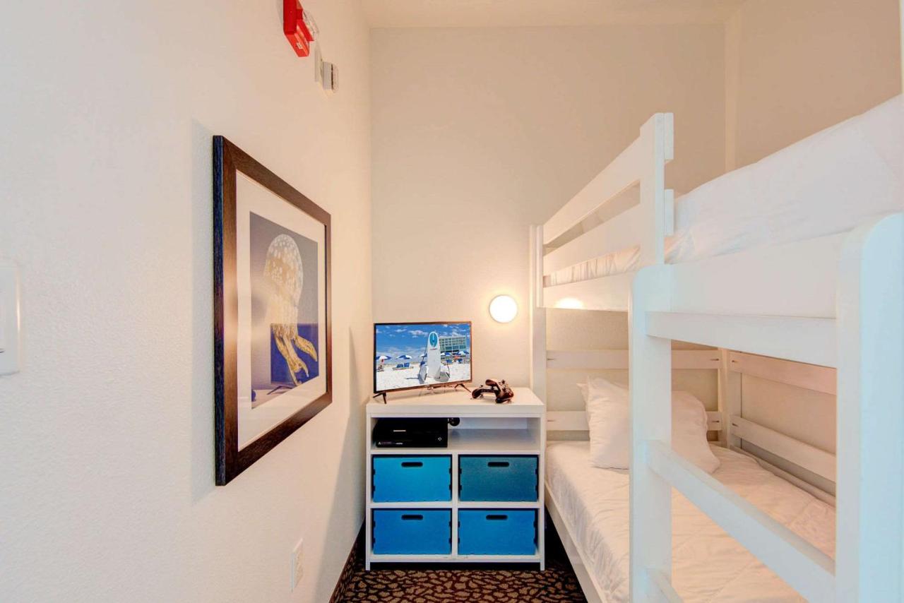 Corner King Suite with Bunk Beds and Sofa Bed - Roll In Shower - Balcony and Panoramic Beach Front